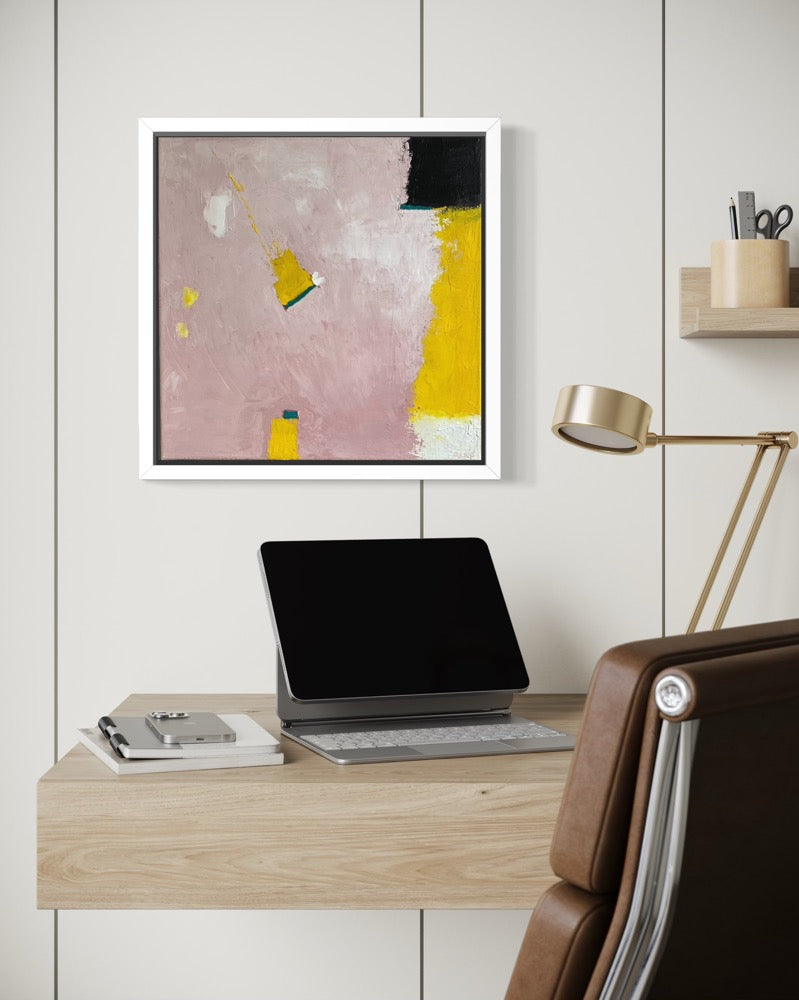 Modern office setup with a desk, laptop, chair, and abstract art on the wall.